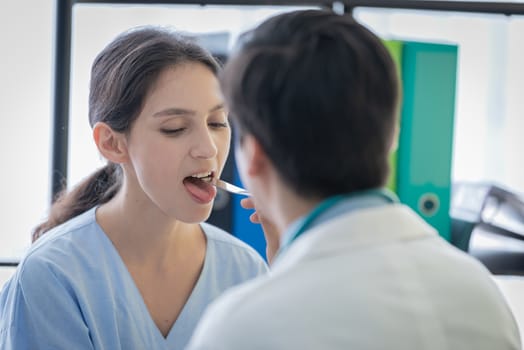 A doctor take care of sick patient woman at the hospital or medical clinic.