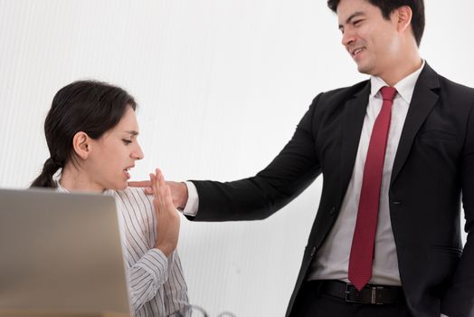 The uncomfortable scared woman and worry by her boss at the office in Sexual harassment at the workplace.