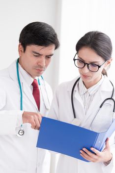 Two doctors have working together with happiness in the hospital.