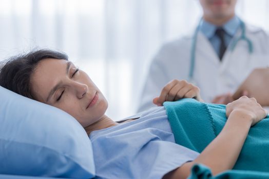 The patient woman has sleeping in the hospital.