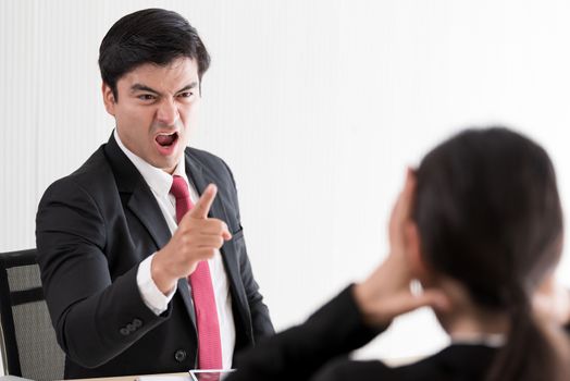 The manager has upset to employee woman with anger and unhappiness.