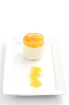 Orange panna cotta isolated in white background