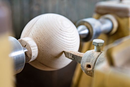 manufacture round wooden handles on lathe in joinery.