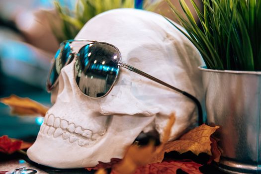 skull with sunglasses in a tattoo studio