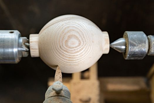 manufacture round wooden handles on lathe in joinery.