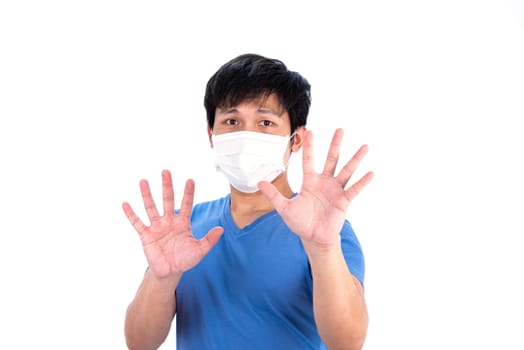 Asian young man in blue t-shirt top and medical mask to protect COVID-19 with isolated on white background concept.