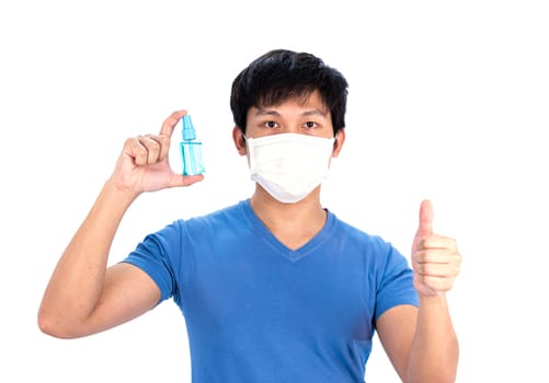 Asian young man in blue t-shirt top with medical mask and hand cleanser gel to protect COVID-19 with isolated on white background concept.