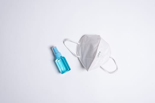 The equipment to protect COVID-19, white mask and hand cleaner gel with Isolated on white background concept.