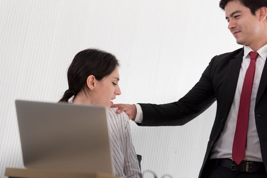 The uncomfortable scared woman and worry by her boss at the office in Sexual harassment at the workplace.