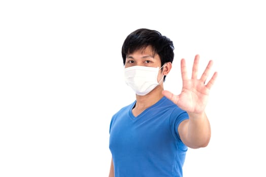 Asian young man in blue t-shirt top and medical mask to protect COVID-19 with isolated on white background concept.