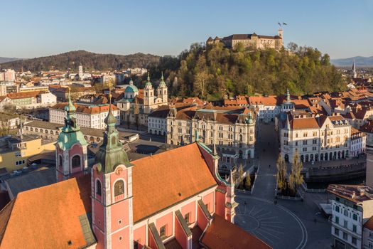 Aerial drone panoramic view of Ljubljana, capital of Slovenia in warm afternoon sun.