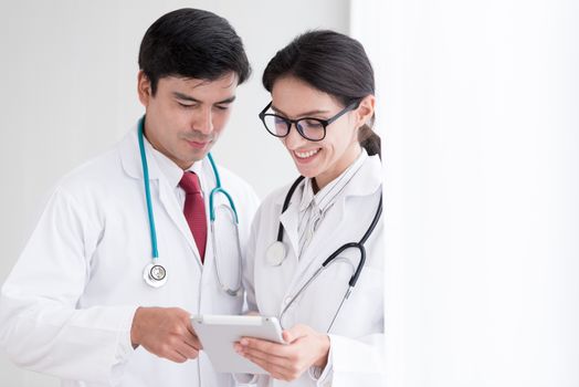 Two doctors have working together with happiness in the hospital.