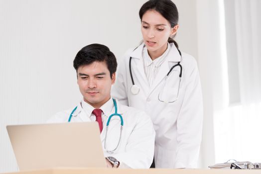 Two doctors have working together with happiness in the hospital.