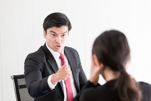 The manager has upset to employee woman with anger and unhappiness.