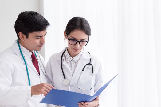 Two doctors have working together with happiness in the hospital.