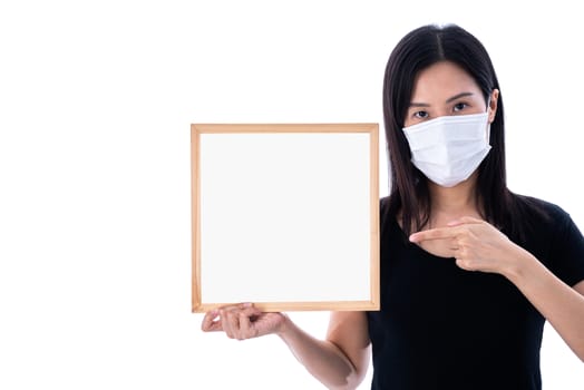 An Asian woman holding an empty board for writing COVID-19 prevention isolated on white background.