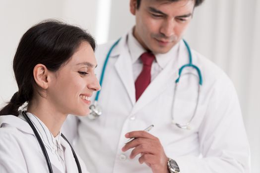 Two doctors have working together with happiness in the hospital.