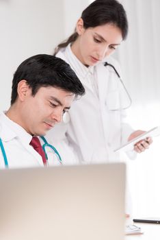 Two doctors have working together with happiness in the hospital.