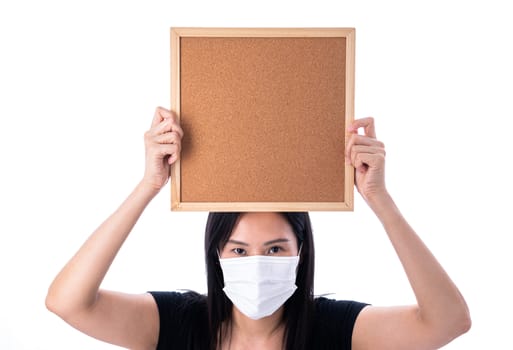 An Asian woman holding an empty board for writing COVID-19 prevention isolated on white background.