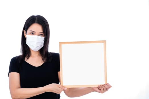 An Asian woman holding an empty board for writing COVID-19 prevention isolated on white background.