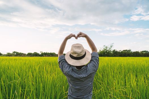 The hand of a farmer girl is made in the shape of a heart to show her love of her career and nature.