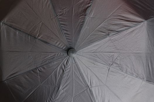 Close up view at the colorful surface of a rainproof umbrella