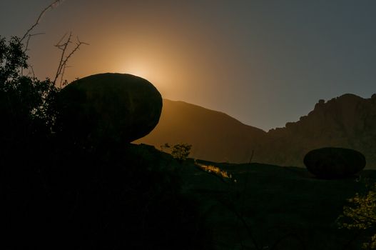 Silhouette of solid granite boulders at sunrise at Ameib in the Erongo Region of Namibia