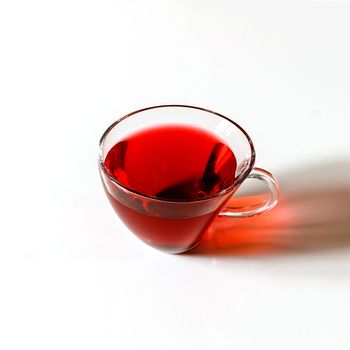 Cup of Karkadeh Red Tea isolated on a white background