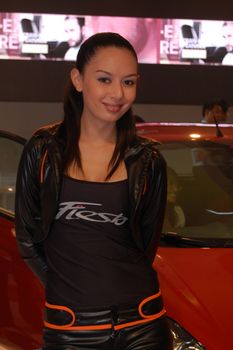 PASAY, PH - AUG. 19: Ford female model at 3rd Philippine International Motor Show on August 19, 2010 in World Trade Center Metro Manila, Pasay, Phillippines.