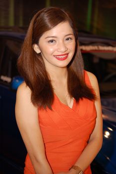 PASAY, PH - NOV 27: Car show female model at Manila Auto Salon on November 27, 2011 in SMX Convention Center, Pasay, Philippines.