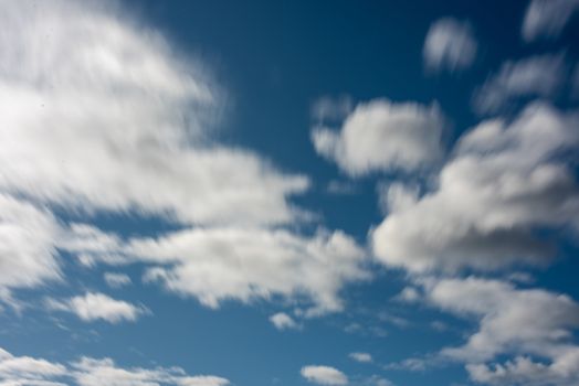 Blurred movement of clouds against sky