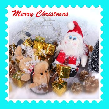 Christmas card postage stamp design with half tone photograph of Santa Claus, reindeer and present gifts