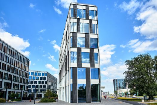 Street with modern office buildings in the city of Poznan