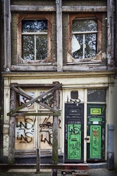 Old derelict abandoned canal  town house in the city of Amsterdam Holland