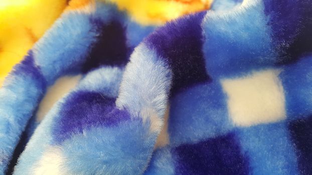 Closeup view of colorful soft blanket for winter season