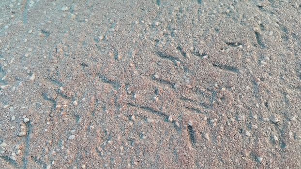 Red colored damaged road or paved pathway with cracks of different shapes. Cracked texture with copy space for text and messages