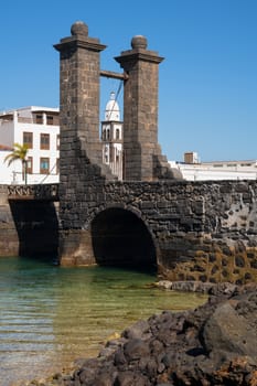 Bridge to the historic fort of Arrecife on a sunny day with blue sky, Lanzarote, Spain