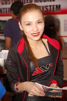 PASAY, PH - APR. 1: AVT female model at 8th Manila International Auto Show on April 1, 2012 in World Trade Center Metro Manila, Pasay, Philippines.