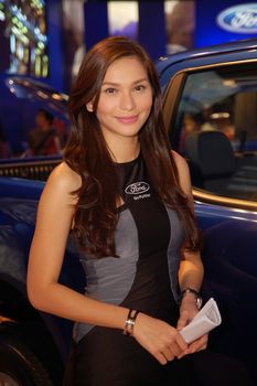 PASAY, PH - APR. 1: Ford female model at 8th Manila International Auto Show on April 1, 2012 in World Trade Center Metro Manila, Pasay, Philippines.