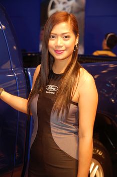 PASAY, PH - APR. 1: Ford female model at 8th Manila International Auto Show on April 1, 2012 in World Trade Center Metro Manila, Pasay, Philippines.