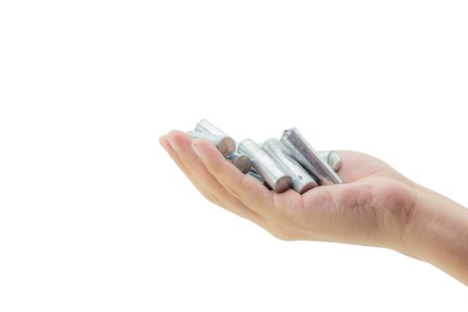 recycle - energy - power - environment and ecology concept - close up of hand holding alkaline batteries heap - clipping part.
