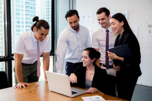 Business team having a meeting using laptop during a meeting and presents.