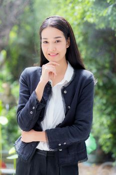 Beautiful of portrait asian young businesswoman with smile standing holding drink coffee, girl is professional corporate, business concept.