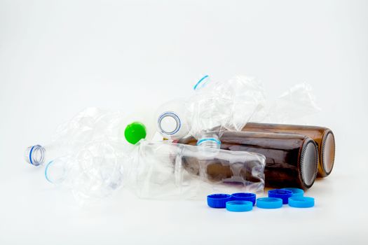 Heap of plastic garbage on white background.