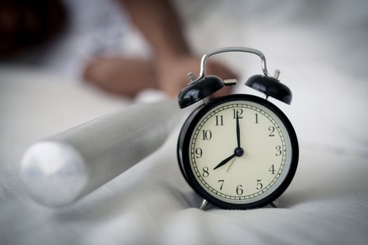 Portrait upset angry with baseball hit young man screaming at alarm clock on bedroom. Employee running late. Time management with business concept