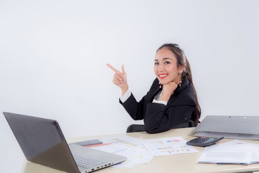 Young businesswoman working in office pointing something.