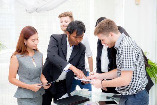 businessman signing a document in the office at meeting room.