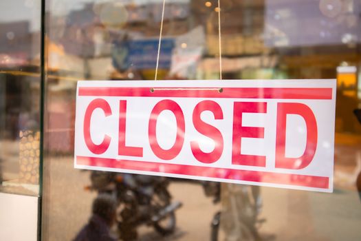 Closed Signage board in front of Businesses or store door due covid-19 or coronavirus outbreak - Concept of business closed due lockdown