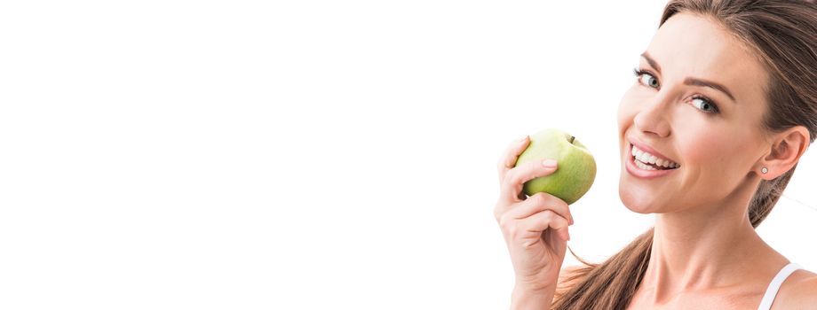 Woman eat green apple isolated on white background with copy space for text