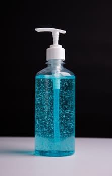 Plastic dispenser sanitizer alcohol gel pump bottle for washing hand hygiene prevention of coronavirus virus studio shot on black background